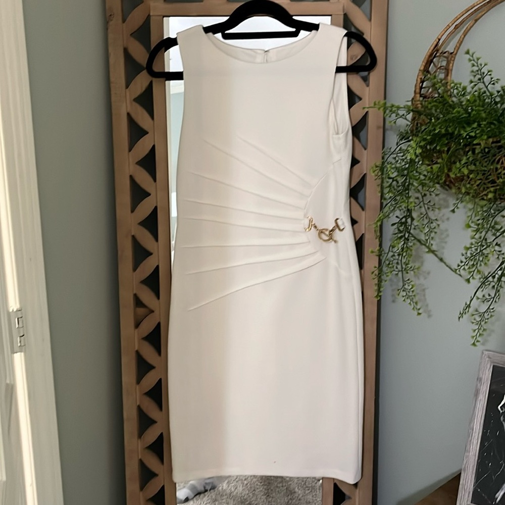 Cream colored dress with gold accents